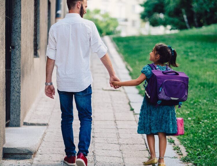 Walking your child to the first day of school now that you have the free time thanks to personal organization with TimeSquared.