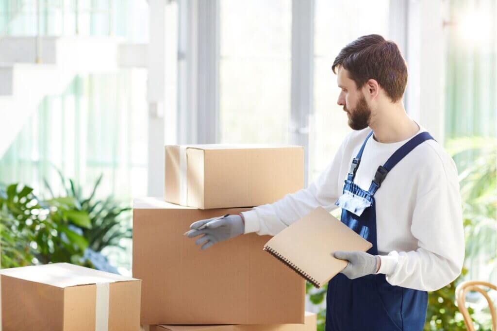 Professional move manager from TimeSquared assisting a client in Edmonton with home packing, scheduling services, and organizing the new living space.