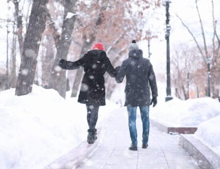 People walking along snowy sidewalks in Edmonton, illustrating concierge help for errands before winter.