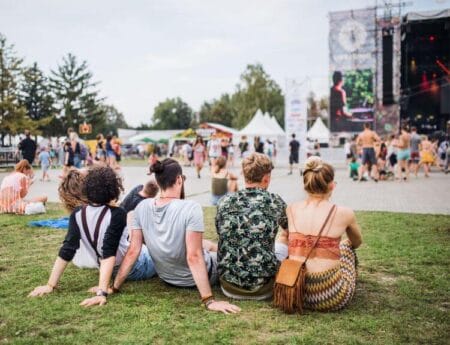 A happy family enjoying food at K-Days, thanks to stress-free summer festival planning.